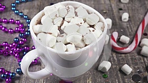 Slow motion marshmallow in a mug with a drink sprinkle with chocolate chips
