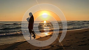 Slow motion of mother and daughter turning around at sunset.