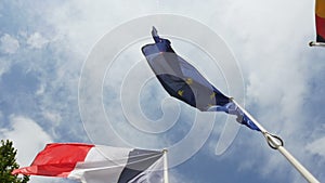 Slow motion over French, German and European Union Flag