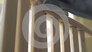 Slow motion. A professional carpenter takes a close-up of the details of furniture made of wood together.Assembling