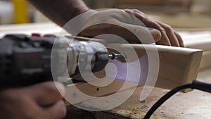 Slow motion. A professional carpenter takes a close-up of the details of furniture made of wood together.Assembling