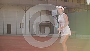 Slow motion : Professional tennis player woman playing on court in afternoon.