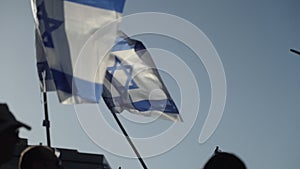 Slow motion of protestors demonstrating with Israel national flags