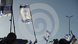 Slow motion of protestors demonstrating with Israel national flags