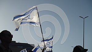 Slow motion of protestors demonstrating with Israel national flags