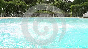 Slow Motion Sequence Of Boy Jumping Into Swimming Pool
