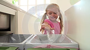 Slow Motion Sequence Of Girl Recycling Kitchen Waste In Bin