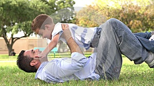 Slow Motion Shot Of Father Playing With Son In Park