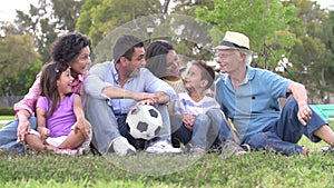 Slow Motion Shot Of Multi Generation Family With Soccer Ball