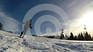 Slow motion of a skier skiing down the slope