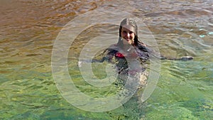 Slow motion of summer season for girl swimming in pool