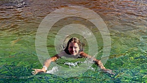 Slow motion of summer season for girl swimming in pool