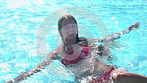 Slow motion of summer season girl in swimming pool