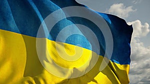 Slow motion of Ukrainian flag wind waving against the sky