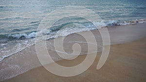 Slow motion vacationer going to swim in sea in evening.