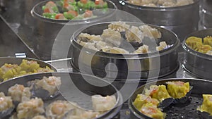 Slow motion Vendor selling Dumpling and Shaomai in Asian Street Food Market