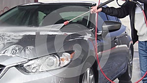 Slow Motion Video of a Car Washing Process on a Self-Service Car Wash