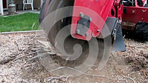 Slow motion video of a stump removal tool in action