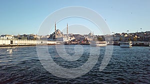 Slow-motion view: Eminonu cityscape, seagulls, ferry.