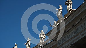 Slow motion view of the statues of the colonnade of St. Peter`s Basilica made by Bernini`s students