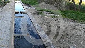 Slow motion of water from a fountain, drinking water fountains in the natural environment,