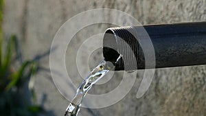 Slow motion of water from a fountain fountain and slow flowing clean clear water slow motion