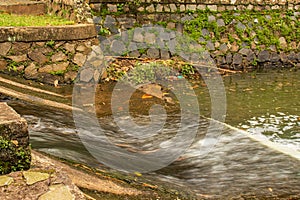 slow motion of water sliding from a small dam