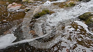 Slow Motion of A Waterfall With Mossy Rocks