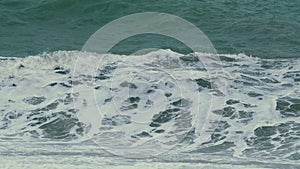 Windy Turbulent Ocean. Waves Breaking Splashing Sea-Spray Water Foam. Dirty Sea During A Storm.