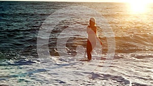 Slow motion woman jogging in morning on beaches sea sand