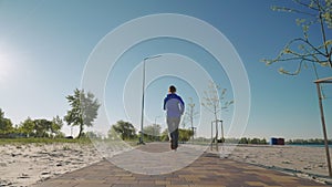 Slow motion woman jogging near beach