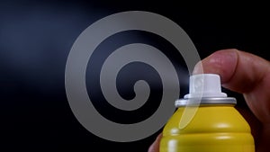 Slow Motion Of Yellow Spray Bottle Drops On Black Background