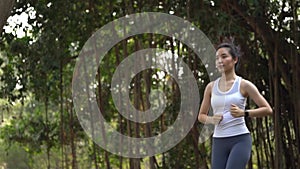 Slow motion young girl run at park