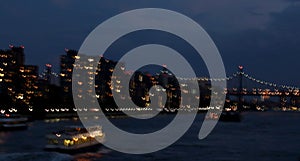 Slow shutter of East River, 59th Street Bridge, boat and city lights