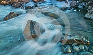 Slow shutter water stream and through rocks