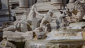 Slow vertical motion view of the runaway horses on Trevi Fountain