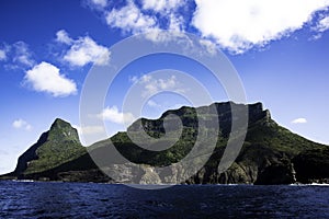 Slowly coasting past Mt Gower in small boat