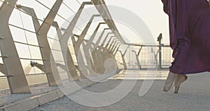 Slowmo of graceful Caucasian ballerina walking on tiptoes. Legs of unrecognizable Caucasian slim woman in pointe shoes