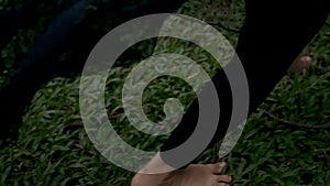 Slowmotion of Foot running fastly on the top of a green grass