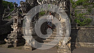 Slowmotion shot of a man tourist visiting the Pura Lempuyang Temple at the Bali island, Indonesia