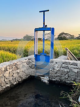 sluice gate or water gate useful for regulating water discharge.