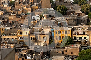 Slum Cairo roofs with satellite dishes. photo