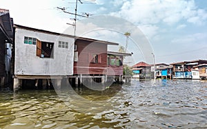Slum on dirty canal in Thailand photo