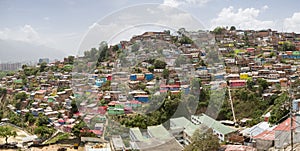Slum district of Caracas with small wooden coloured houses photo