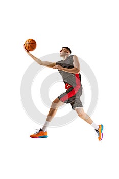 Slum dunk. Winner. Young guy, basketball player in motion, practicing, playing isolated over white background. Sport