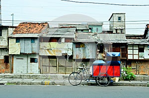 Slum house on the edge of a canal in Jakarta