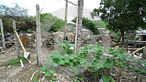 Slums with dump full of garbage poverty travel to asia, misery blighted area, poor living conditions streets