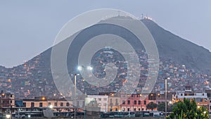 Slums on the slope of hill San Cristobal on the northern side of the river Rimac day to night timelapse. Lima, Peru