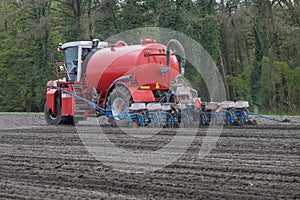 A slurry injector planting maize on arable land