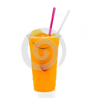 Slush ice with orange in Plastic Cupon white background photo